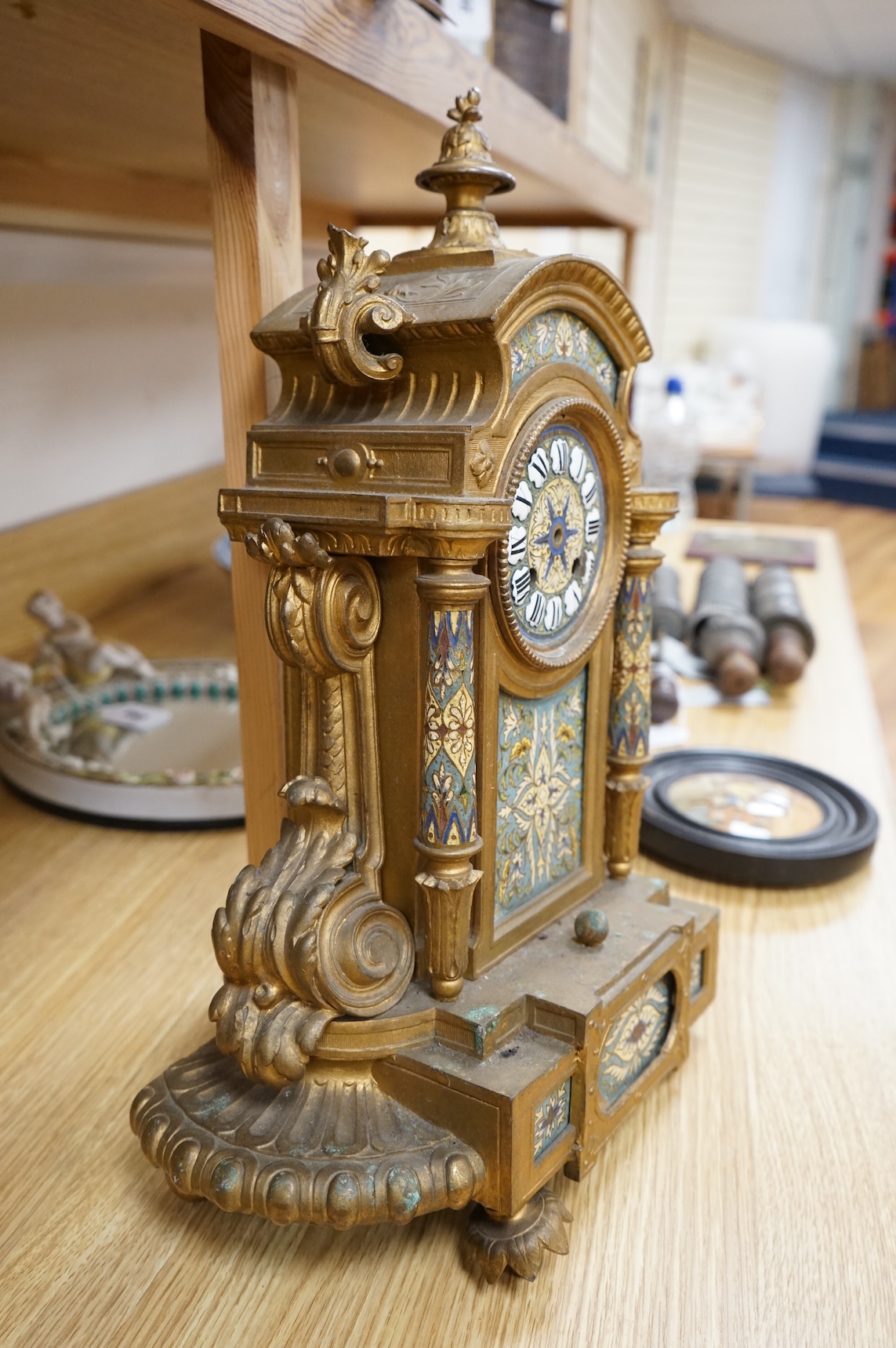 A French gilt metal and champleve enamel clock, 41cm
